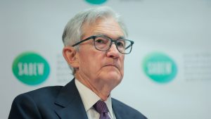 Fed chair says tariffs could drive inflation as Trump calls for interest rate cuts