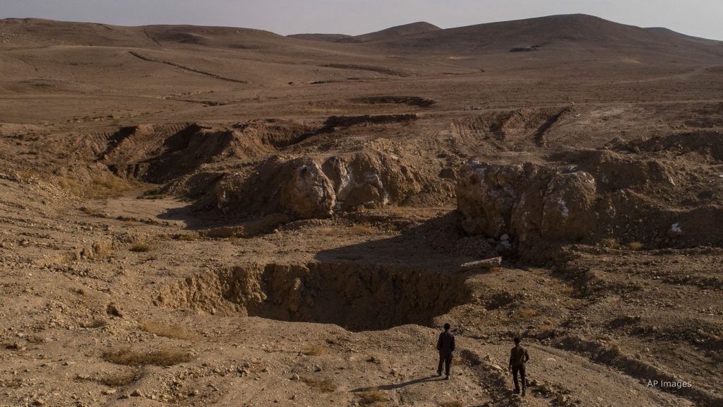 ‘A crime that shocks the mind’: Iraq exhumes mass grave site left by ISIS