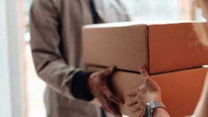 Global postal services hit pause on US shipments as tariff exemption ends