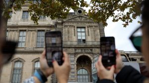 Louvre window becomes unexpected tourist attraction after $100m jewel heist