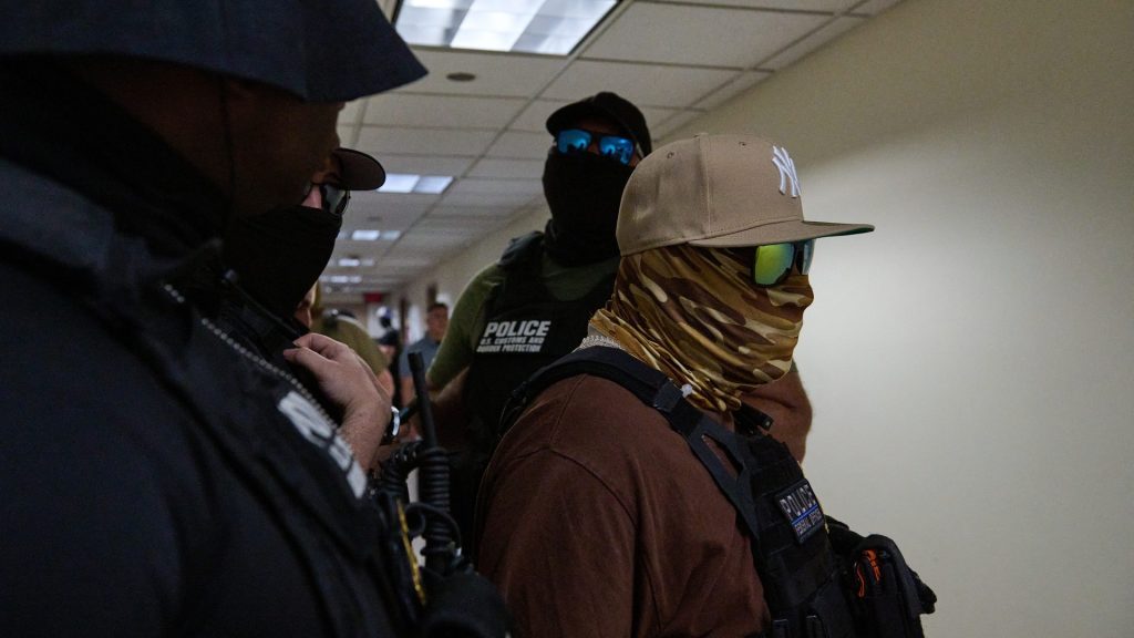 Filming ICE agents is a First Amendment right. So why might it land you in jail?