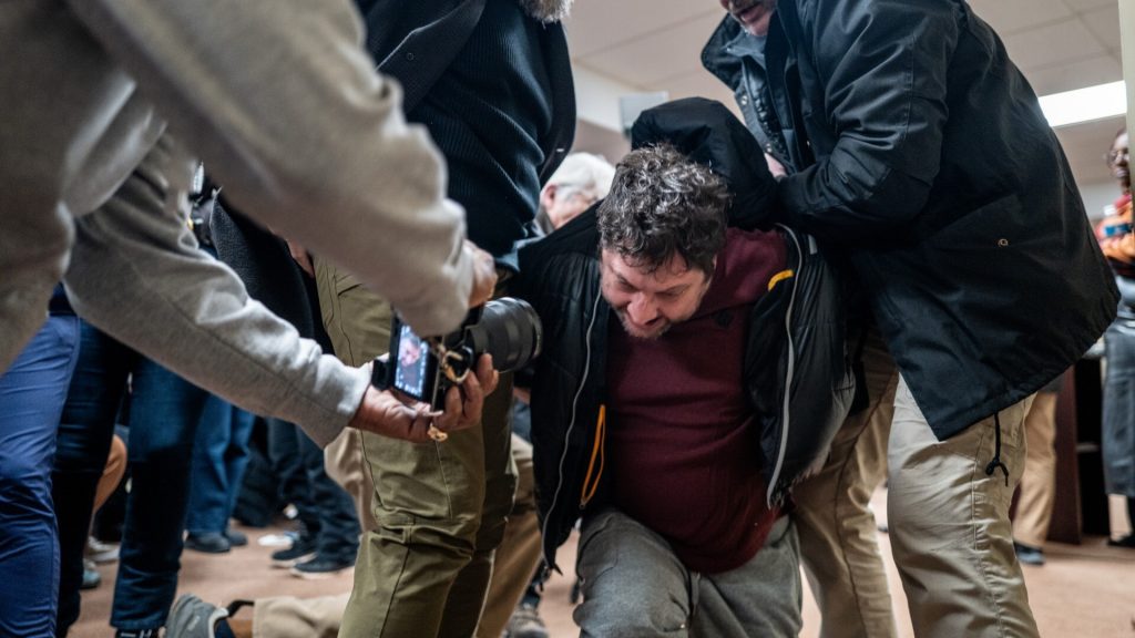 WATCH: Man arrested for attacking Democratic Rep. Ilhan Omar at Minneapolis town hall
