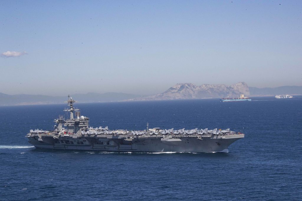 Iran puts ‘fingers on trigger’ as US armada arrives in Middle East