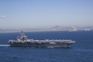 Iran puts ‘fingers on trigger’ as US armada arrives in Middle East
