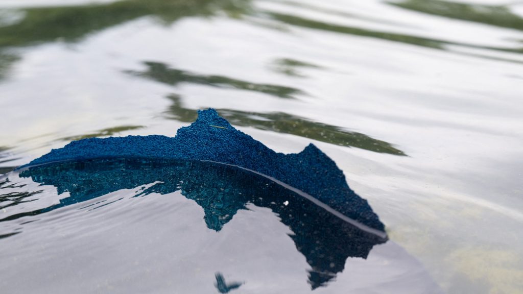 Blue liner floats to surface of newly renovated Reflecting Pool