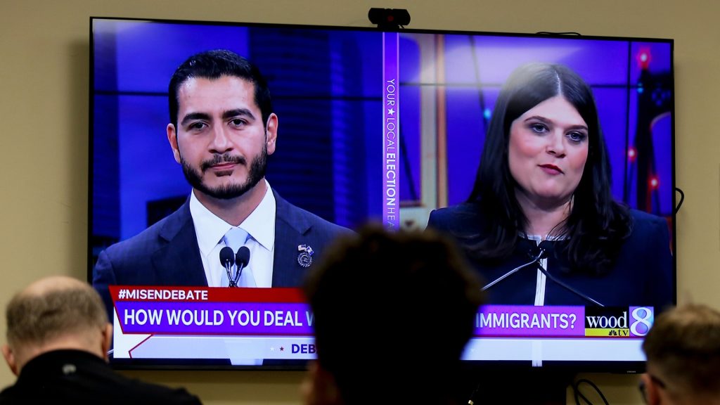Two candidates and a fractured party took the stage in Detroit