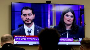 Two candidates and a fractured party took the stage in Detroit