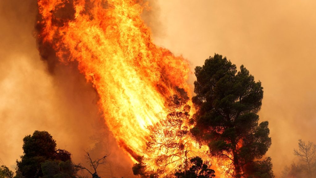 Firefighting helicopters collide as Greece battles wildfires across Europe