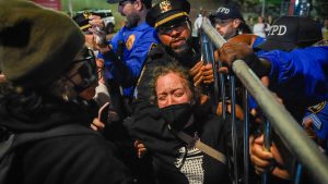 Protesters clash with police after ICE agent shoots man with 5-year-old in car